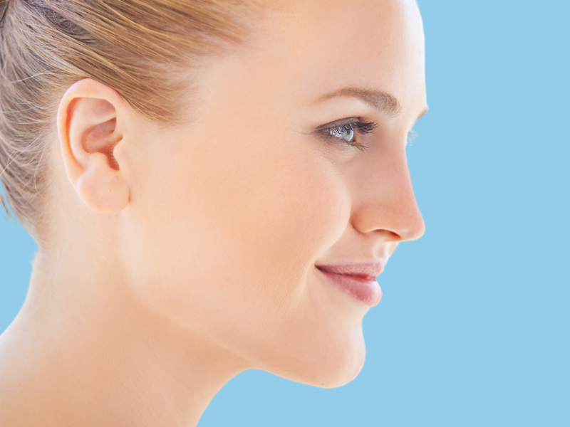 Young woman showing off her nose Young woman with beautiful nose