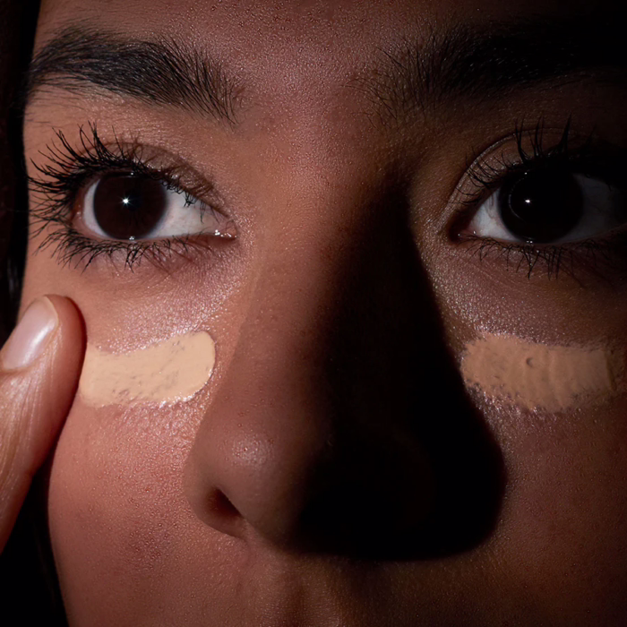 Medik8 Illuminating Eye Balm - applied to face